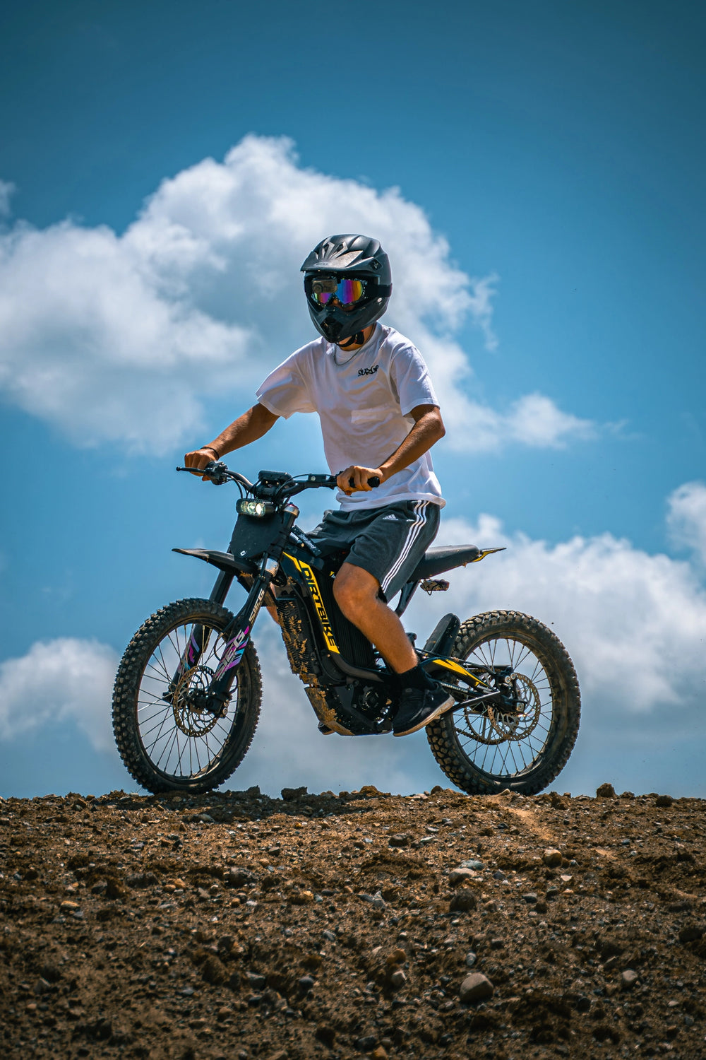 ThunderWasp XR16 automotive-grade alloy electric dirt bike ridden by adult rider on outdoor dirt offroad track