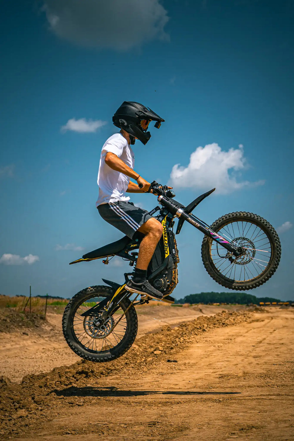 Rider performing mid-air jump on XR16 electric motocross